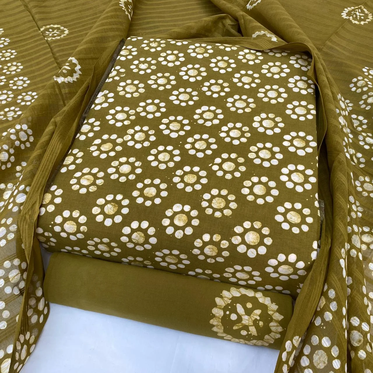 Olive gold batik with concentric dot rosettes
